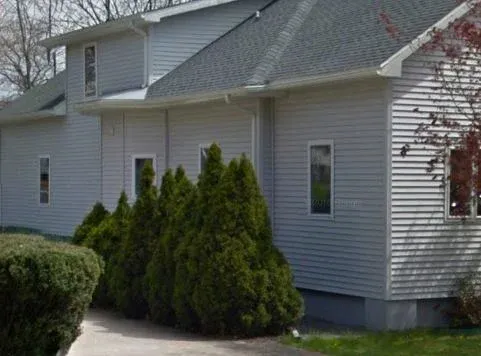 My perch, 40-some years ago, after some significant renovation, and shrubs.