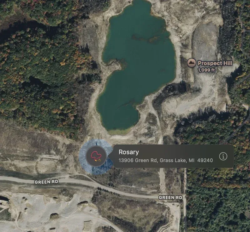 Satellite map showing a pin labeled "Rosary" near a lake off Green Road, Grass Lake, Michigan